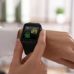 Woman,Measuring,Oxygen,Level,With,Smartwatch,Indoors,,Closeup